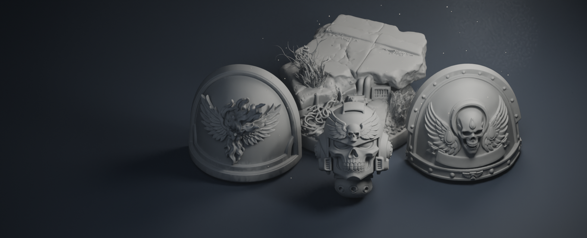Grey miniature helmets, shoulder pads and scenic base on a navy studio set.